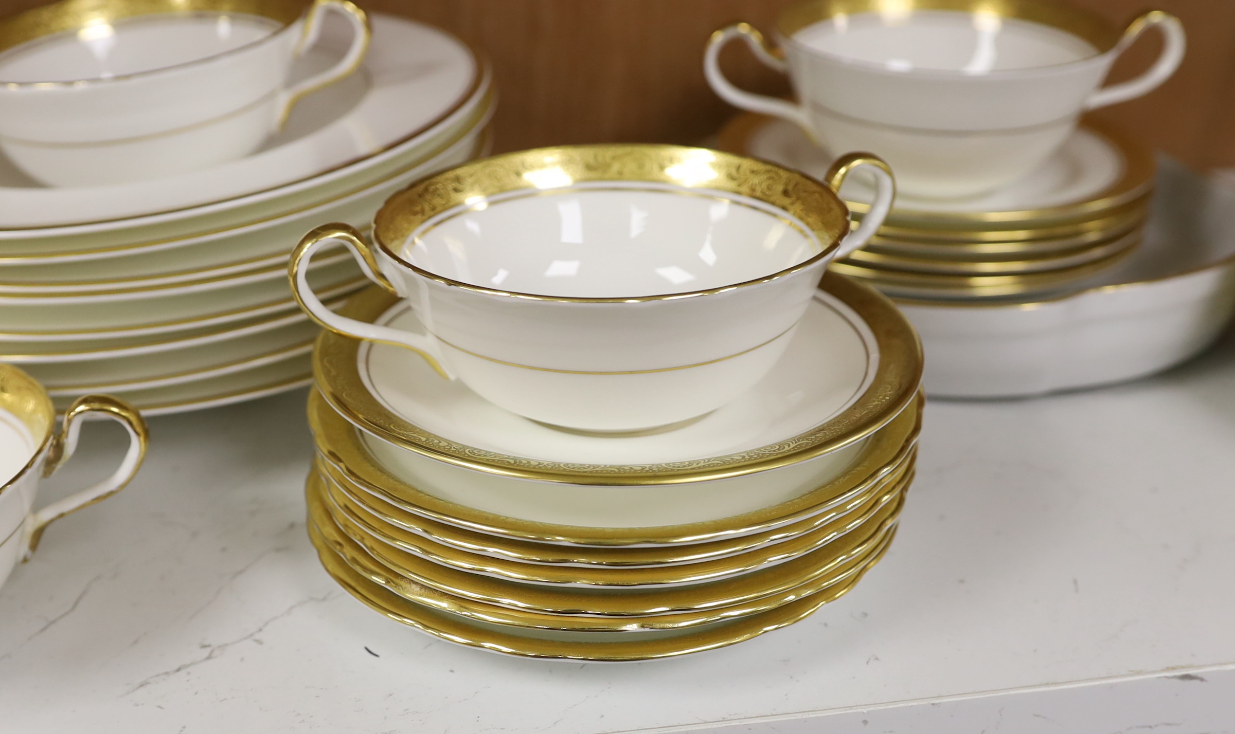 Anysley Argosy, Wedgwood Gold Florentine, Worcester gold decorated dinner wares including coffee pot, soup bowls, twin handled bowls and plates